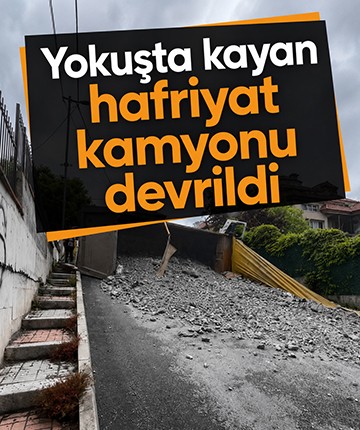 Yokuşta kayan hafriyat kamyonu devrildi